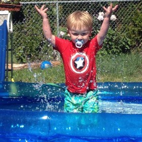 Tim's son playing in a pool