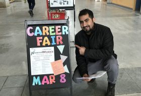 Mosa at a UNBC career fair