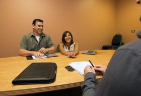 Three people having a meeting