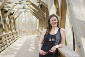 Woman standing on bridge