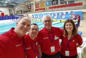 Volunteers at a swimming pool