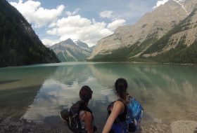 Two women looking over a lake