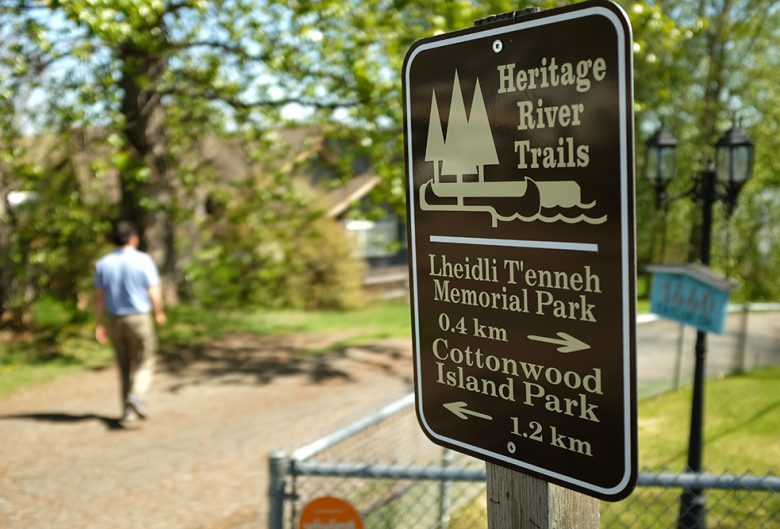 park sign man walking