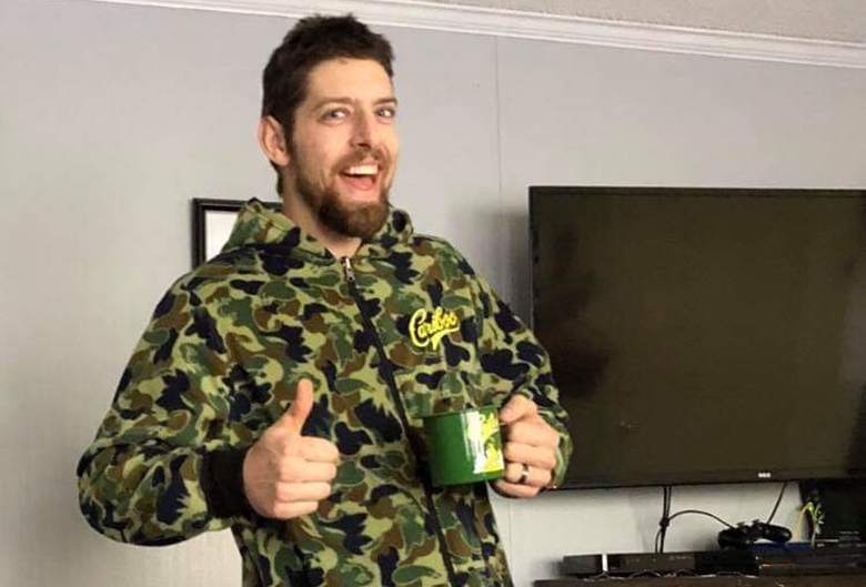 man in camouflage onesie