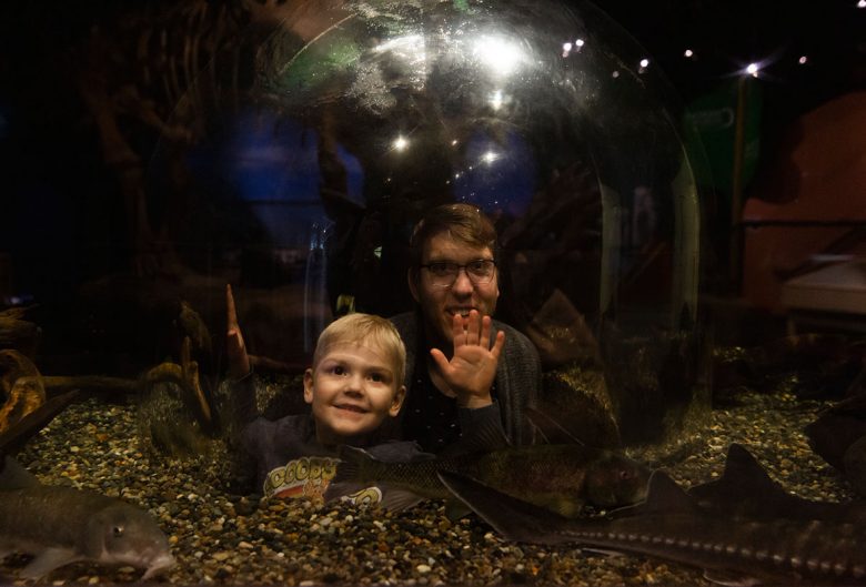 man and kid at museum