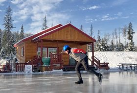 man skating ice oval