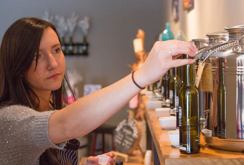 woman pouring oil