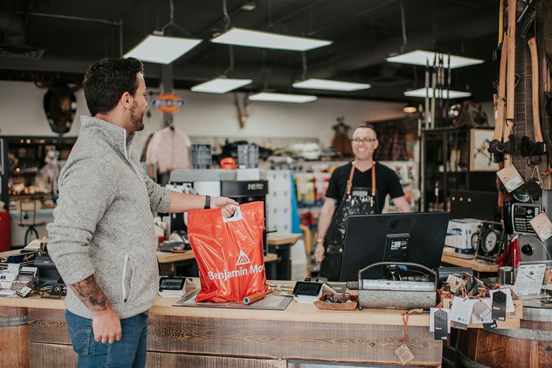 Man and cashier in paint store