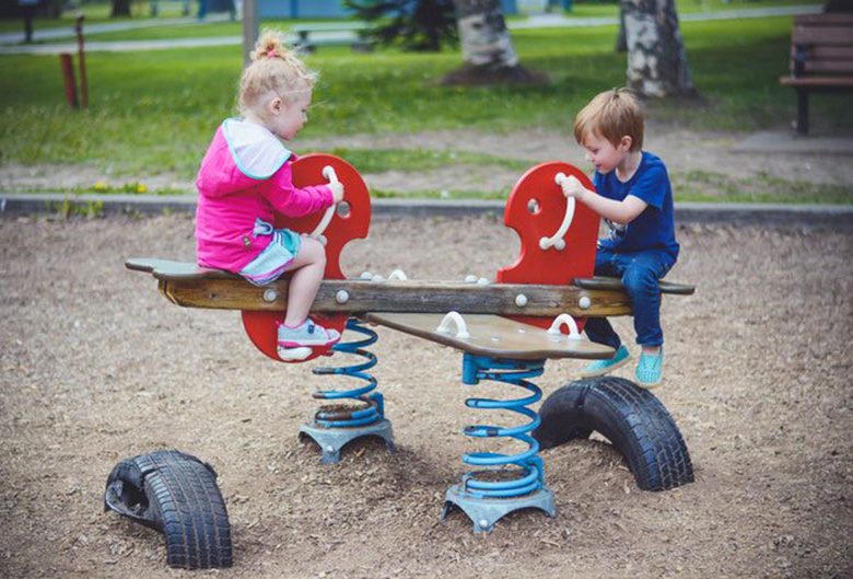 two kids on teeter totter