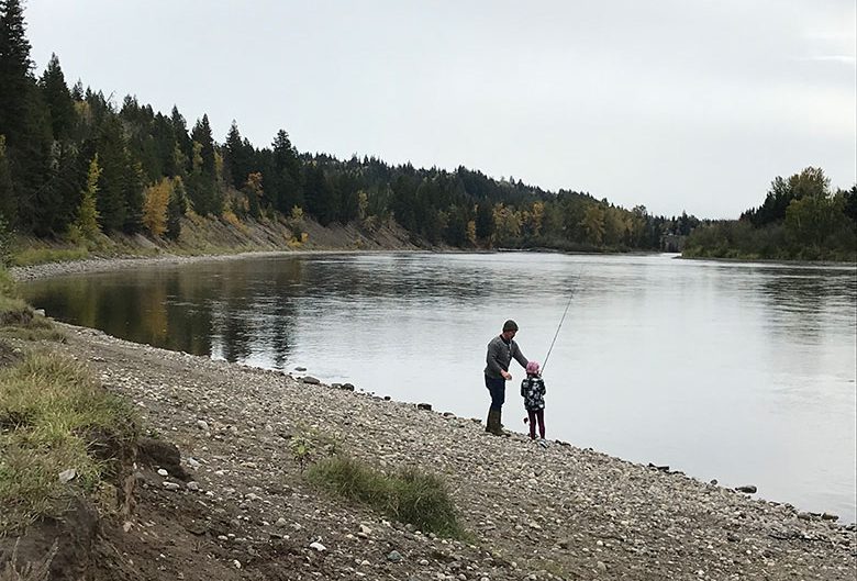 Man fishing with child.