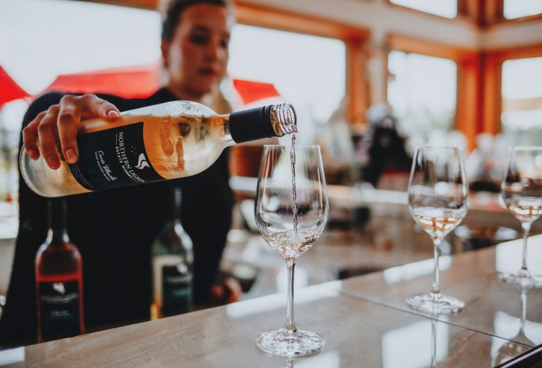 Woman pouring wine.