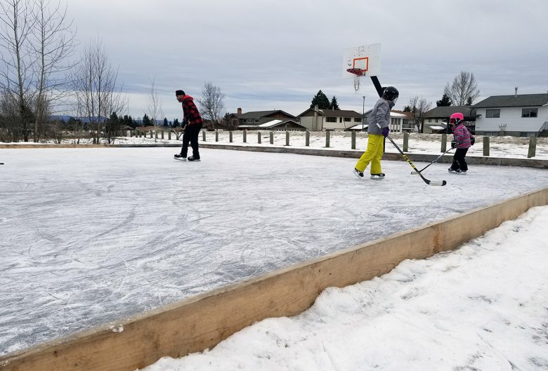 People skating on outdoor rink