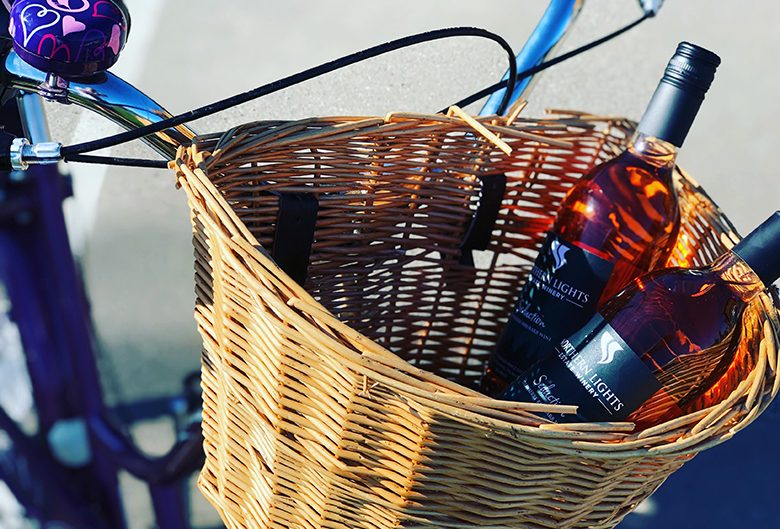 Wine in a bicycle basket.