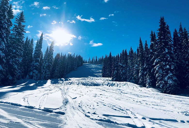 Ski hill under a blue sky.