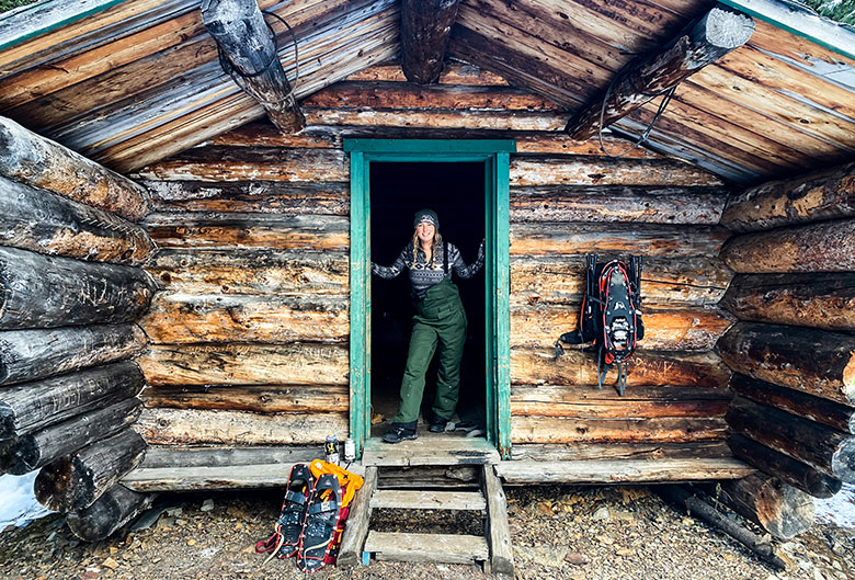 Woman standing in cabin doorway