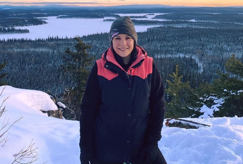 Woman at top of Teapot Mountain.