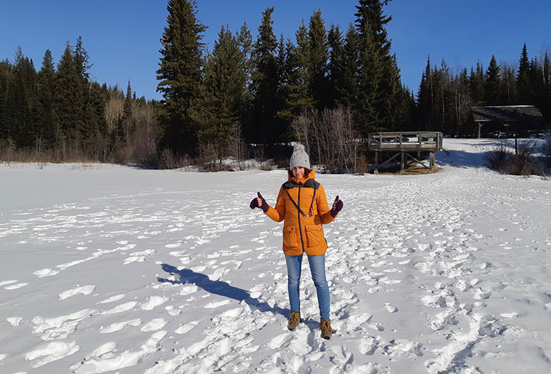 Woman walking on Shane Lake in the winter