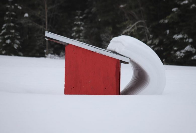 snow sliding off roof